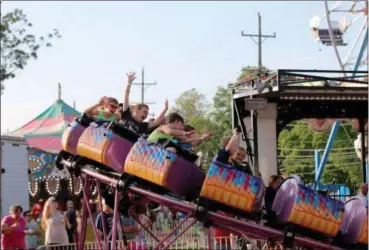  ?? JONATHAN TRESSLER — THE NEWS-HERALD ?? The dragon-coaster delivers some thrills to the younger crowd at the 58th annual Kirtland Kiwanis Strawberry Festival during its opening day June 15.