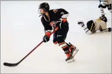  ?? COURTESY PHOTO ?? Marcelo Richert in action during the 21st Coyote Classic held at Taos Youth and Family Center Ice Rink March 16. Richert did his best to lift his team over a trio of tough teams from Colorado during the tourney by pumping in goals in each of his last three games.