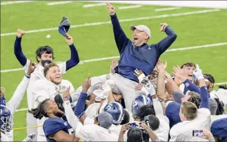  ?? Matthew Hinton / Associated Press ?? Georgia Southern coach Chad Lunsford celebrates his team's victory over Louisiana Tech in the New Orleans Bowl in New Orleans on Wednesday.