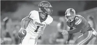  ?? MICHAEL LAUGHLIN/SOUTH FLORIDA SUN SENTINEL ?? University School’s Brandon Inniss runs around the McArthur defense during the first half of their football game on Sept. 6, 2019. Inniss, a rising sophomore wide receiver, was the first player to accept an invitation to the 2023 All-American Bowl.