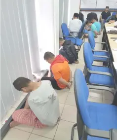  ??  ?? Some of the gang members handcuffed at the police station in Sibu following their arrest early yesterday morning.