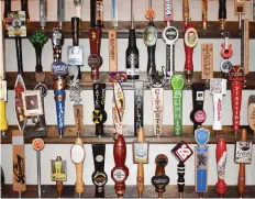  ??  ?? Choice City Butcher and Deli features a colourful array of tap handles in addition to its current selection of beer in downtown Fort Collins.