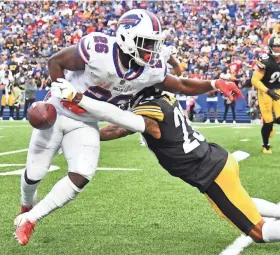  ?? MARK KONEZNY/USA TODAY SPORTS ?? Bills running back Devin Singletary fumbles the ball out of bounds on a tackle by Steelers cornerback Joe Haden.