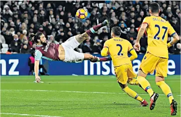  ??  ?? Hammer blow: Andy Carroll scores the second with a superb volley, which his manager described as a contender for goal of the season