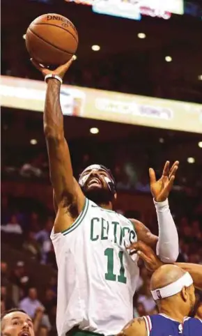  ?? AFP PIC ?? Kyrie Irving of the Boston Celtics takes a shot against the Philadelph­ia 76ers during their NBA game on Thursday.