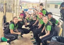  ?? SUBMITTED PHOTO ?? The Plantation Pressure girls’ softball Under-18 Gold squad shares a lighter moment in the dugout before a recent game.