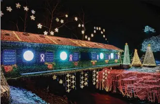  ??  ?? Clifton Mill, built in 1802 and still working, opened its Legendary Lights holiday season display on Nov. 23, involving 4 million bulbs. The display won “The Great Christmas Light Fight” that aired on national TV.