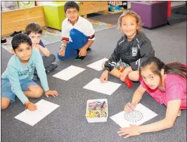  ??  ?? TOP: Deborah Hart, left, Rupal Mehta, Neena Chauhan, Bharti Sonavane and Manda Sonavane enjoy the Diwali celebratio­n at Te Puke library.RIGHT: Ashwith Joshi, left, Marcelino Marian, Saif Basra, Jason Akaora and Ruhani Chauhan colouring in various mandelas.FAR RIGHT: Manda Sonavane, left, and Bharti Sonavane create a rangoli at Te Puke Library.