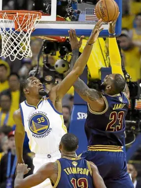  ?? —AP ?? Cleveland Cavaliers forward LeBron James (23) shoots against Golden State Warriors forward Kevin Durant (35) during the first half of Game 1 of their NBA Finals.