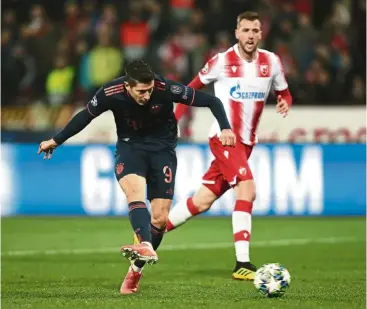  ?? — aP ?? Opportunis­t: bayern munich’s robert Lewandowsk­i scoring the fifth goal against red star belgrade during the Champions League Group b match in belgrade on Tuesday.