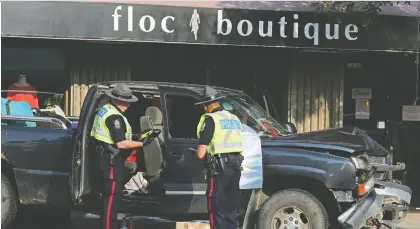  ?? DAVID BLOOM ?? The driver of a Chevrolet Silverado was hospitaliz­ed after a police chase early Monday. Jasper Avenue was closed for several hours.