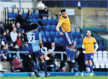  ?? Picture: Ryan Hiscott/JMP ?? Bristol Rovers’ Jonson Clarke-Harris, right, heads the ball at Wycombe