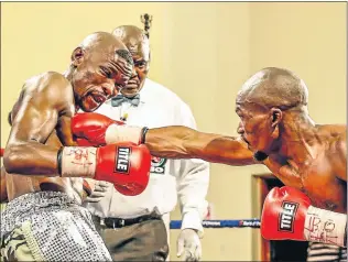  ?? Picture: NICK LOURENS ?? FEELING THE PAIN: Nkosinathi Joyi, left, has not fought since losing against Simpiwe Konkco, right, at Orient Theatre in December last year