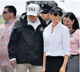  ??  ?? High stakes: Melania Trump, top, boards Air Force One for Texas in four-inch heels before arriving, above, in a FLOTUS cap