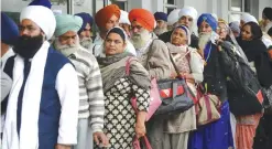  ??  ?? AMRITSAR: Indian Sikh devotees gather at the railway station at Attari, some 35kms from Amritsar yesterday as they prepare to leave on a Pakistani train bound for Lahore to mark the 547th birth anniversar­y of Guru Nanak Dev. —AFP