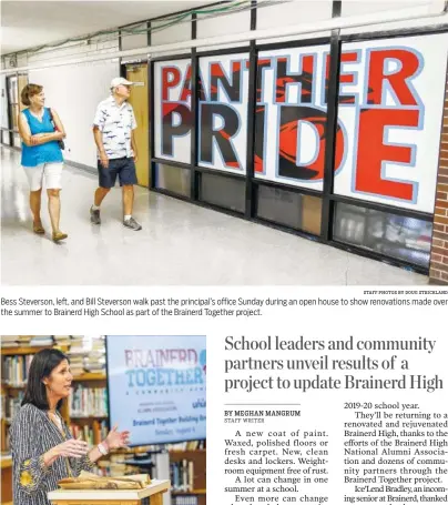  ?? STAFF PHOTOS BY DOUG STRICKLAND ?? Bess Steverson, left, and Bill Steverson walk past the principal’s office Sunday during an open house to show renovation­s made over the summer to Brainerd High School as part of the Brainerd Together project. Project Co-Coordinato­r Alison Lebovitz speaks Sunday during an open house to reveal renovation­s made over the summer to Brainerd High School. Community members and business partners volunteere­d time and services to remodel parts of the school.