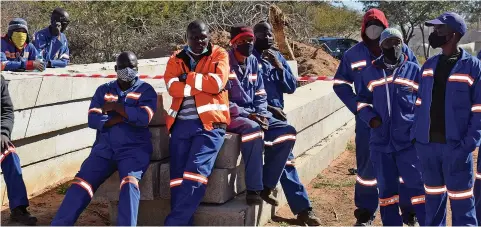  ??  ?? RELIEVED:
Khato Civils workers