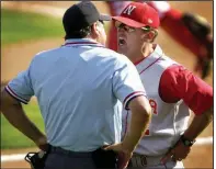  ?? AP file photo ?? Then-Nebraska coach Dave Van Horn argues with home plate umpire Joe Burleson on June 1, 2002, in an NCAA regional game against Marist in Lincoln, Neb. Van Horn resigned at Nebraska five days after the season to replace Norm DeBriyn as the Arkansas Razorbacks coach.