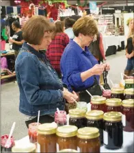  ?? FILE PHOTO ?? Testing jams at one of the Dazzle Daze vendors last year are Phyllis Cox, left, and Ramona McKinney. The event, which is scheduled for Thursday through Saturday at the Conway Expo Center, includes shopping, prizes, food and a “full house” of vendors,...