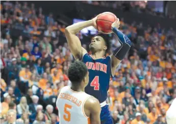  ?? GETTY IMAGES ?? Bryce Brown (19 points) helped Auburn win the SEC tournament for the first time since 1985.