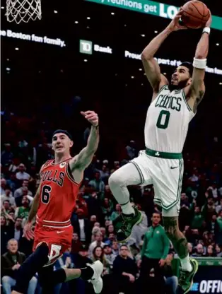  ?? JIM DAVIS/GLOBE STAFF ?? When the shot clock is running down, Jayson Tatum and the Celtics are at their best attacking the basket rather than firing up long jumpers.