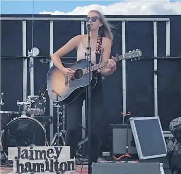  ??  ?? Jaimey Hamilton performs at a recent show. The three-time cancer survivor fell back on her love of music during her lengthy chemothera­py and treatment sessions, Charla Huber writes.