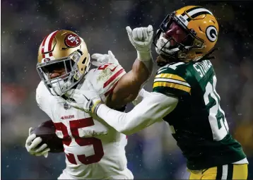  ?? NHAT V. MEYER — BAY AREA NEWS GROUP, FILE ?? The 49ers' Elijah Mitchell (25) is called for a face masking penalty against the Packers' Eric Stokes (21) in the third quarter for their NFC divisional playoff game at Lambeau Field in Green Bay, Wi., on Jan. 22.