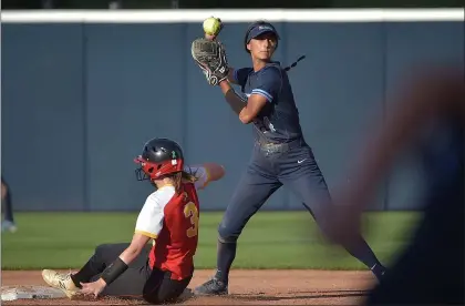  ?? PETE BANNAN – MEDIANEWS GROUP ?? North Penn’s shortstop Sofia Collins, right, turns a double play as Haverford’s Shannon Gavigan slides into second. North Penn went on to win 11-0in the PIAA Class 6A Championsh­ip at Beard Field at Penn State University Thursday.