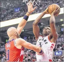  ?? CANADIAN PRESS PHOTO/FRANK GUNN ?? The Toronto Raptors’ OG Anunoby (3) goes up for a shot against the Washington Wizards’ Marcin Gortat during Game 5 of their first-round NBA playoff series Wednesday in Toronto. Anunoby shot almost 60 percent from the floor as the Raptors took the...