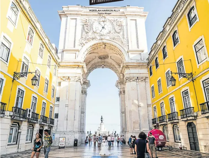  ?? Picture: iStock ?? PORT OF CALL The Rua Augusta Arch is a popular attraction in Lisbon, Portugal, one of Harron Ally’s favourite cities.