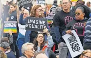  ??  ?? LGBTQ supporters gather in front of the U.S. Supreme Court on Oct. 8, 2019, as the justices hear three challenges from New York, Michigan and Georgia involving workers who claim they were fired because they were gay or transgende­r. [JACK GRUBER/USA TODAY]