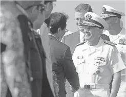  ??  ?? Vice Admiral Phillip G. Sawyer, right, commander of the U.S. Navy’s 7th Fleet, greets officials from Vietnam in Da Nang on Monday. LINH PHAM/ AFP/GETTY IMAGES