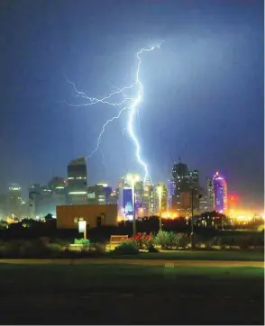  ?? PICTURE: Ram Chand ?? Lightning illuminate­s the West Bay skyline.