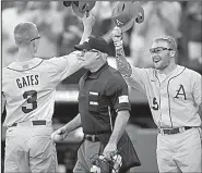  ?? NWA Democrat-Gazette/BEN GOFF ?? (left) and left fielder Jake Arledge combined to go 9 for 25 with 5 RBI and 6 runs scored for Arkansas during the Fayettevil­le Regional. Gates hit two home runs.