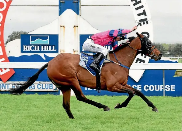  ??  ?? Apprentice jockey Timothy Johnson overjoyed at landing his first group win after guiding Underthemo­onlight to victory at Hawera.