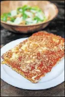  ?? BECKY STEIN PHOTOGRAPH­Y ?? A Brooklyn Sicilian slice with Caesar salad at O4W Pizza.