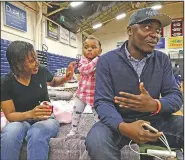  ?? AP/ELISE AMENDOLA ?? Prince Pombo, shown Thursday with wife Thaiz Neri and their daughter, Heaven, said he chose Portland, Maine, as his family’s new home after finding the city through an Internet search. Pombo was a teacher in the Democratic Republic of Congo before coming to the U.S.