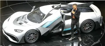  ??  ?? Superstar’s hypercar: Lewis Hamilton introduces the petrol-electric hybrid Project 1
