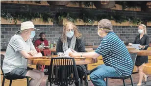  ?? NATHAN DENETTE THE CANADIAN PRESS ?? Patrons sit on the patio at Joey Sherway in Toronto on Wednesday. Toronto and the GTA entered Stage 2 of opening on Wednesday.