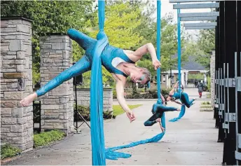  ?? ANDY CARROLL FOR PUBLIC ENERGY ?? Public Energy has offered video of past performanc­es, such as “Elements: Air and Water” — an aerial silk performanc­e — via its online Rewind Room each week for a free livestream performanc­e on Facebook, Instagram, YouTube and its website.