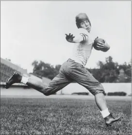  ?? FILE — THE ASSOCIATED PRESS ?? University of Chicago halfback Jay Berwanger is shown in 1934 in the action pose that served as the model for the Heisman Trophy.