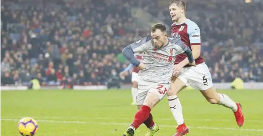  ?? Associated Press ?? Liverpool’s Xherdan Shaqiri scores against Burnley during their English Premier League match at the Turf Moor in Burnley, England, on Wednesday.