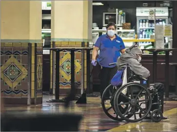  ?? Photograph­s by Jason Armond Los Angeles Times ?? A UNION STATION janitor cleans the food court area. In the first two months of this year, violent crime at the transporta­tion hub has shot up 94% over the same period last year, and property crime has doubled.