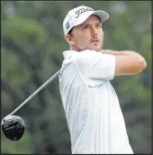  ?? Chris Seward The Associated Press ?? Russell Henley follows through on a shot from the 18th tee Saturday in the Wyndham Championsh­ip’s third round at Sedgefield Country Club.