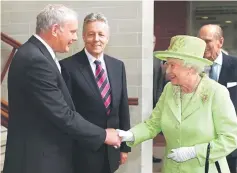  ??  ?? Files photo shows Queen Elizabeth shaking hands with McGuinness watched by First Minister Peter Robinson (second left) and Prince Philip (right) at the Lyric Theatre in Belfast, Northern Ireland on June 7, 2012. — AFP photo