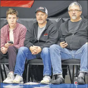  ?? DAVID JALA/SALTWIRE NETWORK ?? This group of Cape Breton Highlander­s fans watched Sunday’s game against the London Lightning from courtside seats located between the two players’ benches. From left are André Leclair, Shawn Leclair and Danny Macinnis.