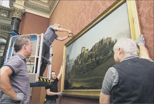  ??  ?? Bernardo Bellotto’s The Fortress of Konigstein from the North being installed at The National Gallery in London.