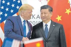  ?? FOTO: DPA ?? US-Präsident Donald Trump (links) und der chinesisch­e Präsident Xi Jinping am Rande des G20-Gipfels im japanische­n Osaka.