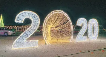  ?? WENDY FOX WEBER/NEWS-SUN ?? Santa’s Rock N Lights at the Lake County Fairground­s features giant colorful dinosaurs and peacocks.