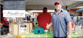  ?? RITA GREENE/MCDONALD COUNTY PRESS ?? Shawn Cooper, president of the McDonald County Chamber of Commerce, gives a thumbs up to the success of the Oktoberfes­t sponsored by the Chamber on Saturday.